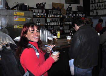 Judit drinking a replica at La Piojera